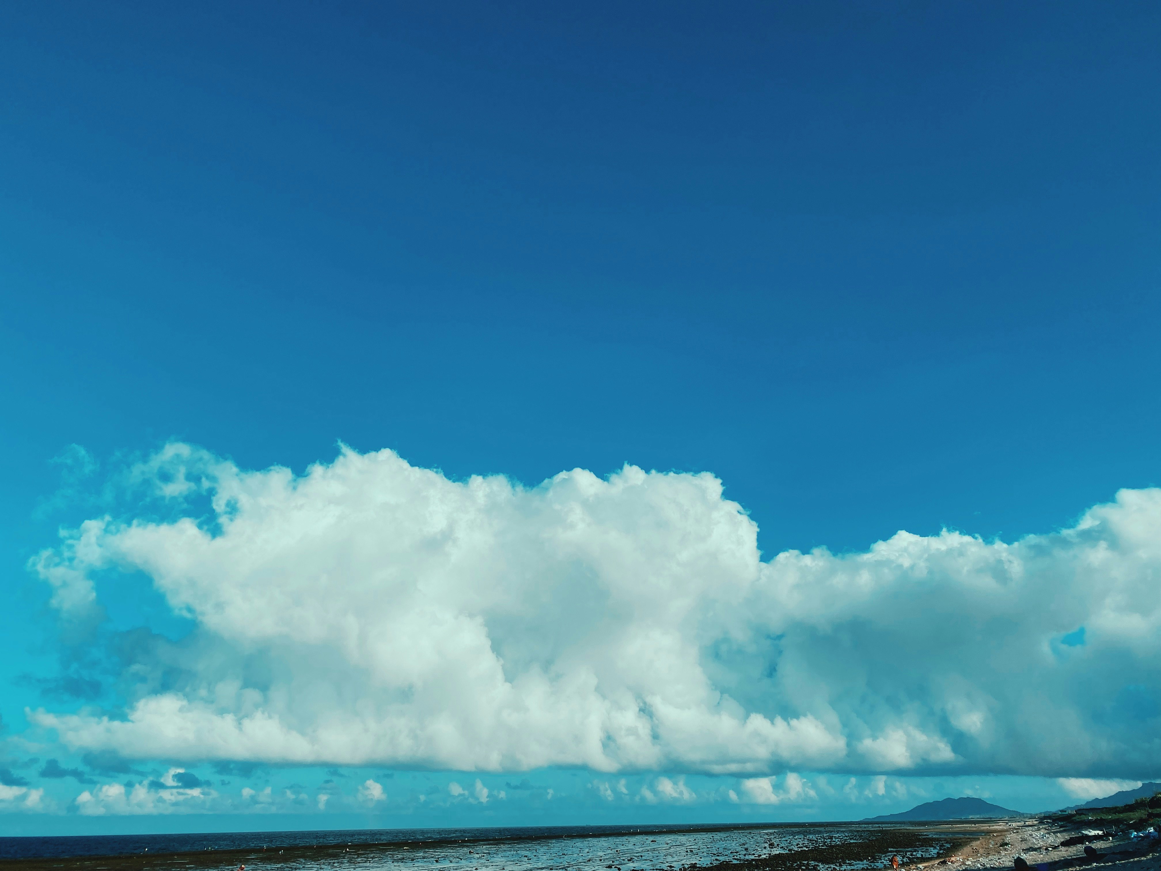 white clouds over blue sea during daytime